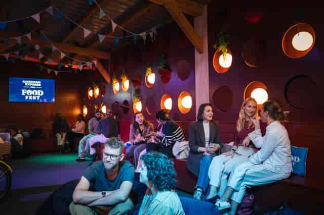 The Milano Snug experiential lounge with tiered amphitheater seating at a food festival.