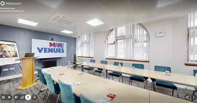 Boardroom-style Kingham Suite at Broadway House with natural light for corporate meetings or training.