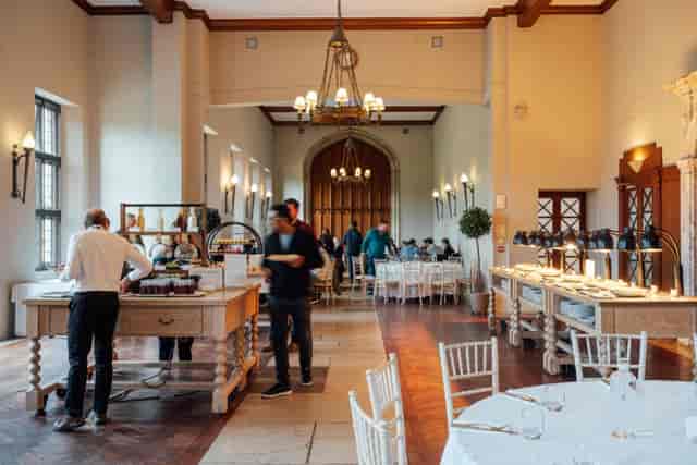 Repton Hall at Ashridge House: Upscale event venue with oak buffet stations for luxury receptions.