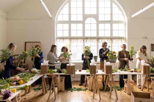 Minimalist conservatory workshop space for corporate events and team building.
