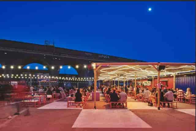 Full venue hire at Luna Springs with industrial lighting for corporate events and parties.