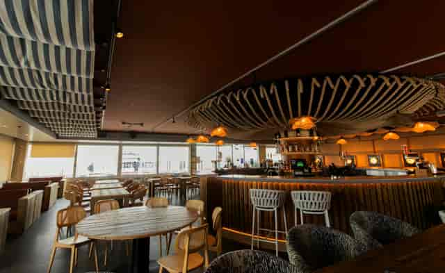 Drift event venue featuring a sleek focal bar, ideal for corporate mixers and networking receptions.