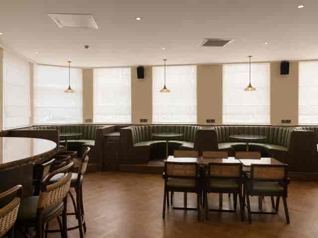 Ground Floor breakout space with banquette seating for networking events and team briefings.
