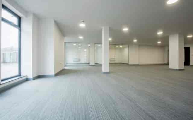 Modern event space at The Lamp House with natural light and structural columns for venue hire.