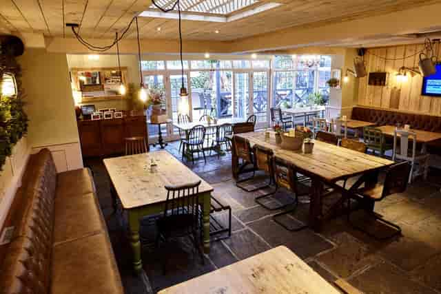 Patchworks breakout space with rustic-chic decor for professional networking and event dining.