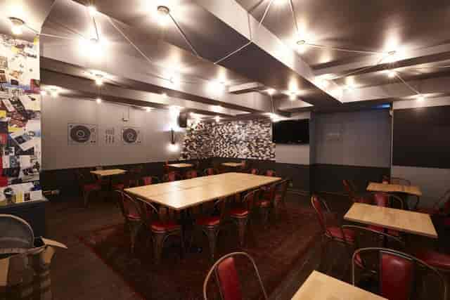 Patchworks industrial boardroom space for collaborative team meetings and networking events.