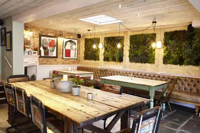 Patchworks rustic private dining room with warm lighting for intimate events and workshops.