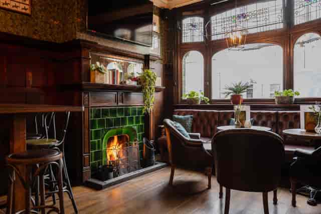 Public Bar at The Foresters: Cozy fireside seating for networking and informal meetings.