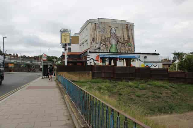 Garden in the Foresters pub exterior with mural for off-site meetings and event venues.