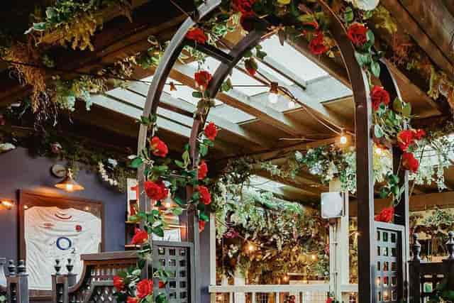 Floral-adorned pergola at The Prince Albert, perfect for bridal showers and intimate event spaces.