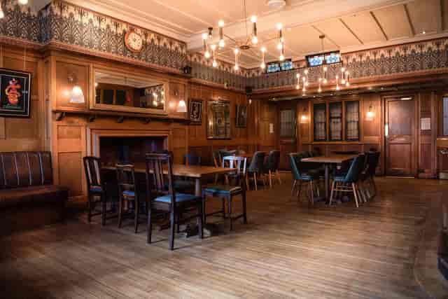 Wood-paneled sports bar at The Elephant Inn for corporate dinner and private workshop events.