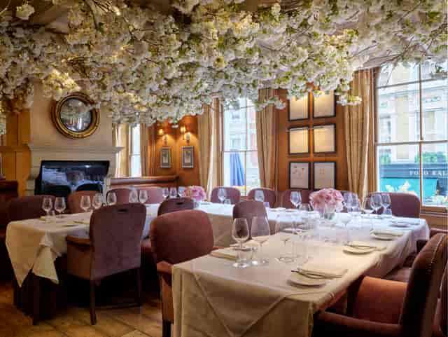 Clos Maggiore private dining room with immersive floral ceiling for luxury events and celebrations.