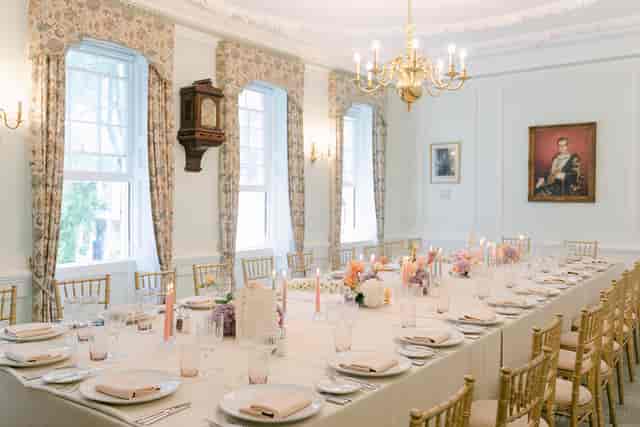 Elegant private dining room with gold Chiavari chairs for upscale corporate events or dinners.