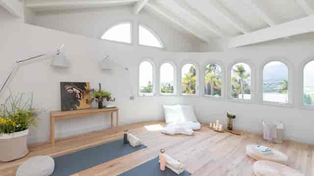 Serene studio space for wellness retreats and executive offsites with natural light.
