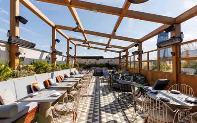 Llama Inn rooftop bar for all-weather networking events and seated dining.
