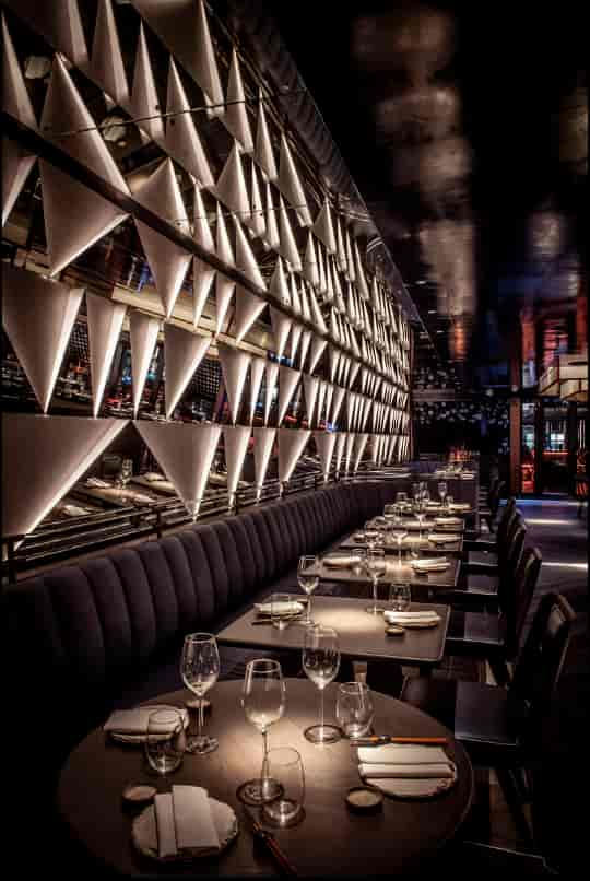 Aqua Kyoto banquette dining with atmospheric lighting for VIP dinners and corporate events.