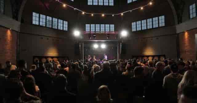 Industrial-chic Wylam Brewery venue hosting a lively corporate event with vaulted architecture.