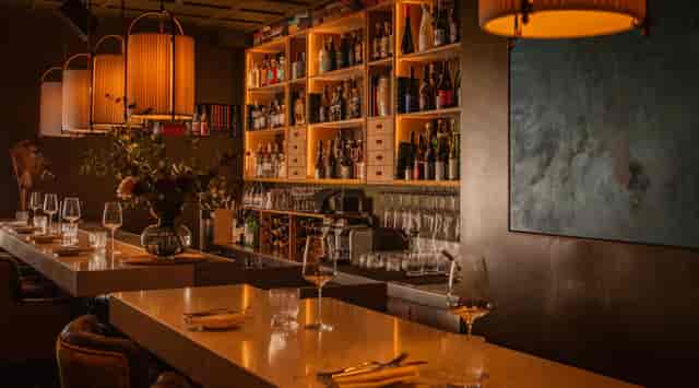 La Bibliothèque lounge with atmospheric lighting for VIP networking and private events.