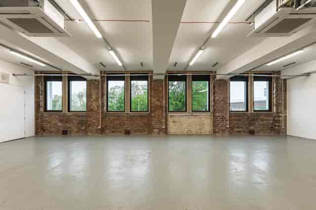 Industrial-chic event venue with raw brickwork for creative exhibitions and corporate hire.