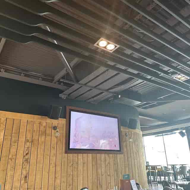 Industrial event space at Ludo Sports & Live Lounge Exeter for corporate mixers and viewing parties.