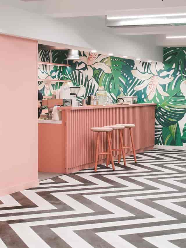 Modern coffee bar at Structure Wellness with floral mural for corporate event or brand activation.