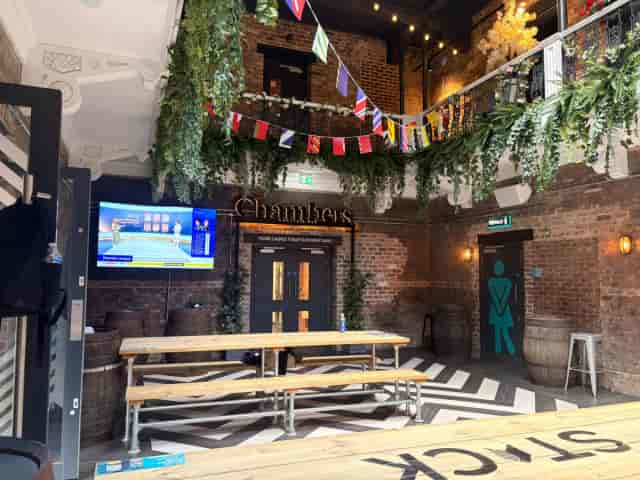 Industrial-chic STACK Newcastle Auction Hall with bench seating for networking and team events.