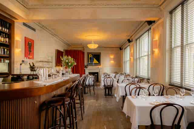 Art Play Shoreditch private dining room with bistro seating for corporate events.