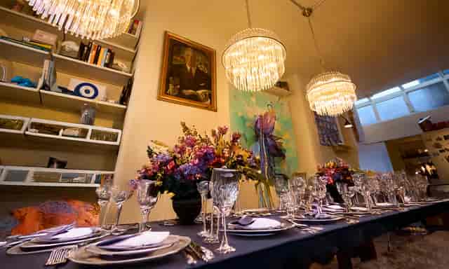 Private dining room at Art Play Shoreditch with floral centerpieces for boutique events and dinners.
