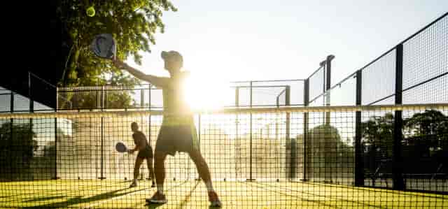 Corporate team-building padel match at The Courts, Hyde Park for active networking events.