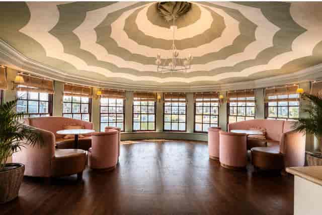 The Boathouse at The Mitre Hotel: light-filled venue with architectural ceilings for networking events.