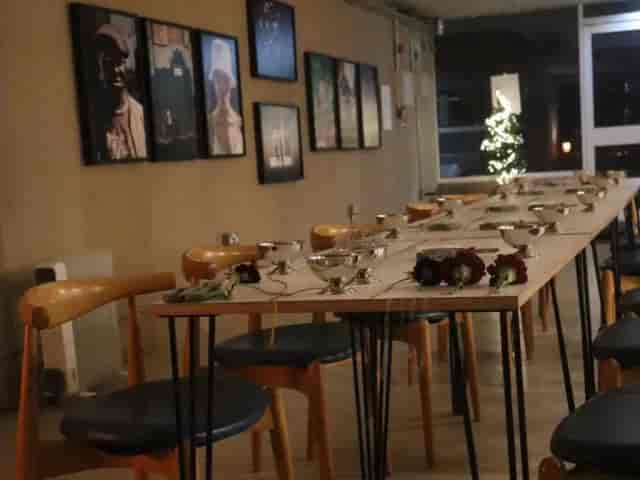 Main Hall gallery-style event space with mid-century modern decor for private dining or workshops.