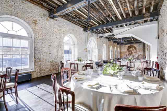 Industrial-chic event space in Woolwich Front Room, ideal for corporate dinners and social functions.