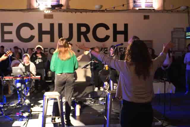 Main Hall at St Swithun’s Church featuring minimalist staging for experiential event networking.