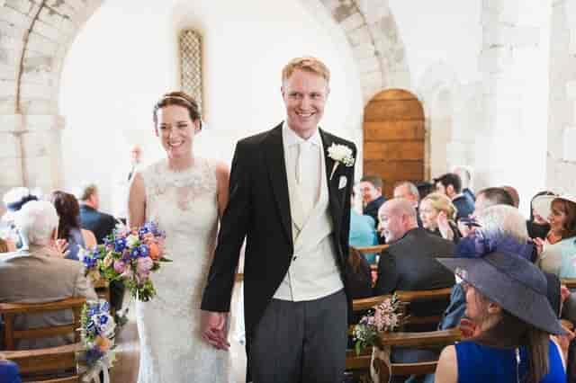 Wedding recessional in St Swithun's Church Main Hall featuring historic aisle architecture.