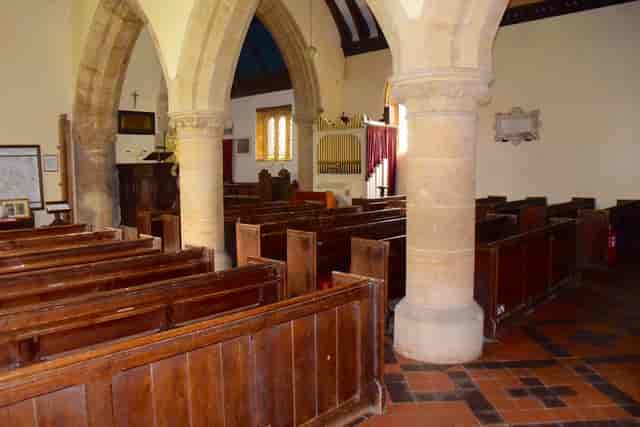 Main Hall at St Swithun's Church: stone pillar venue for historic weddings and events.