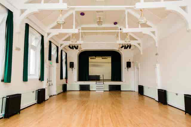 Historic Main Hall with vaulted ceilings, ideal for community events and theater productions.