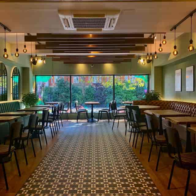 Upstairs venue at The Veg Box Cafe with flexible seating for corporate workshops and networking.