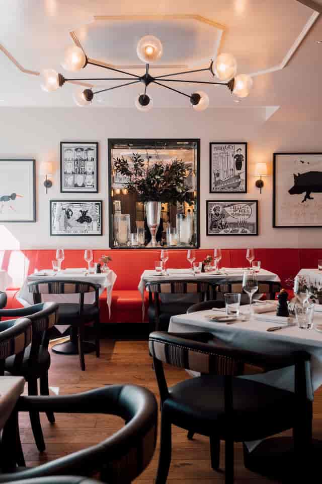 Upstairs event space with banquet seating for intimate corporate dinners and networking events.