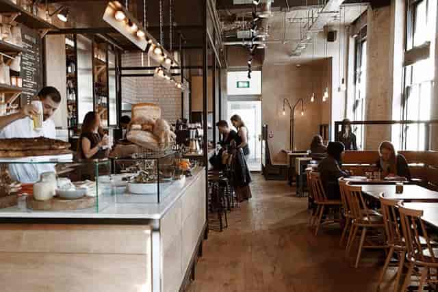 Modern Grind Shoreditch café with wooden accents, natural light for meetings and networking events