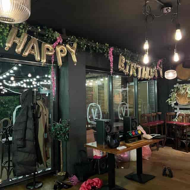La Bottega Italian wine bar with festive balloons, perfect for cozy private events and celebrations.