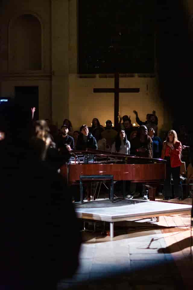 Main Hall stage at St Leonard’s Church with dramatic spotlights for live events and performances.