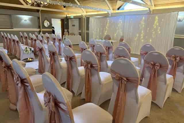 Wedding ceremony in St Leonard’s Main Hall with fairy-light backdrop, ideal for elegant weddings.
