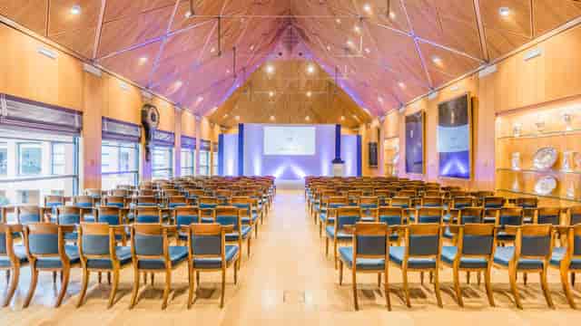 St Richard's Church Centre hall with wood paneling, ideal for professional presentations or events.