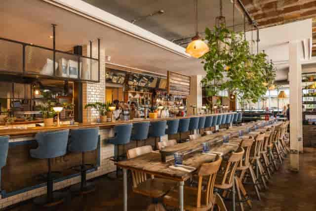 Industrial-chic Stables venue at Riding House Café for networking receptions and team lunches.