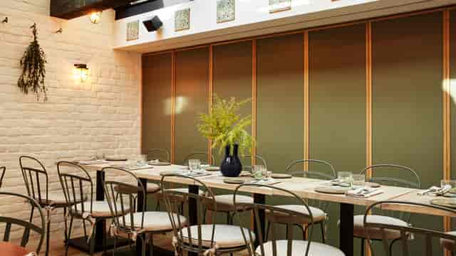 The Stables private dining room with partition wall for corporate dinners and networking events.