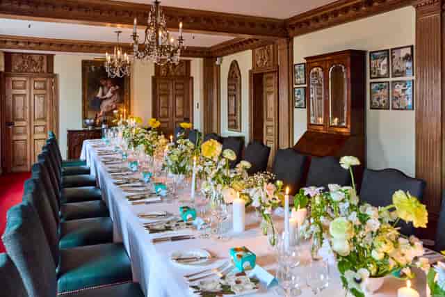 Boardroom dining table with elegant floral decor at Fortnum & Mason for luxury corporate events.