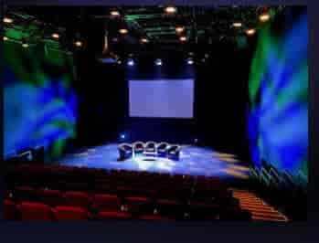 Professional panel discussion stage with projection lighting at Northern Stage Newcastle event.