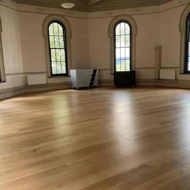 Main hall at Old School Rooms Clapton Park with hardwood floors, ideal for workshops and events.