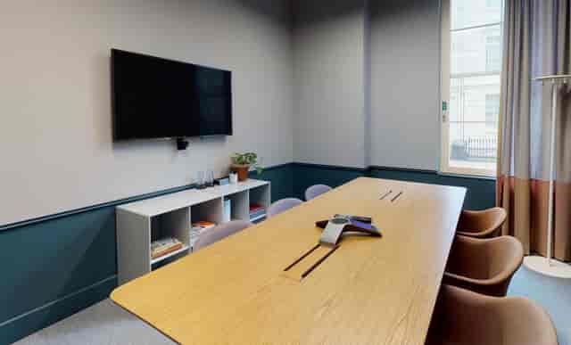 Modern boardroom with integrated tech for strategy sessions and hybrid client meetings.