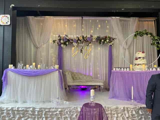 Wedding sweetheart stage with fairy light backdrop at Hogarth Youth Centre event venue.